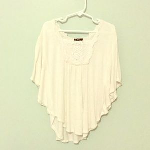 A top that it’s sleeve covers the arm a little.